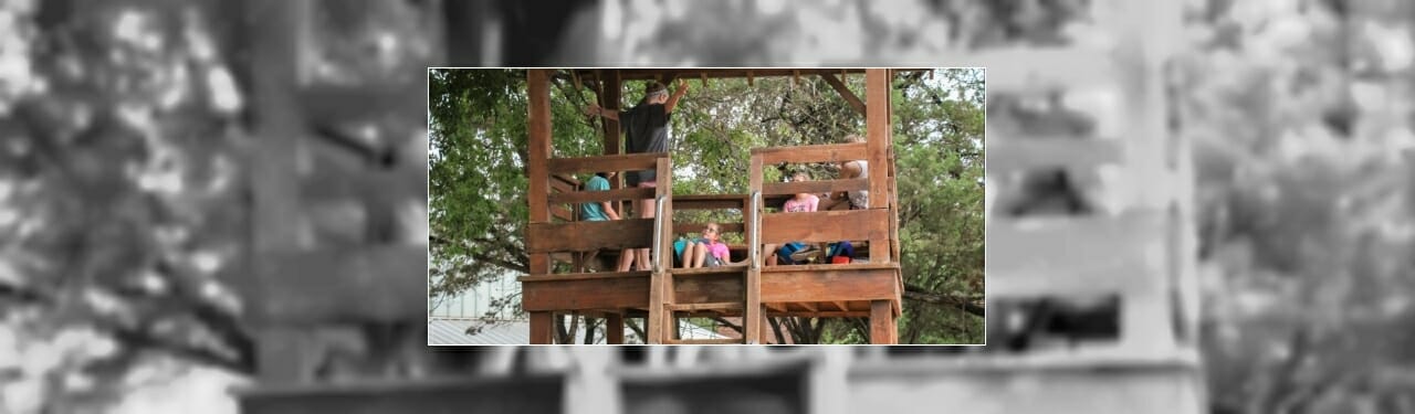 Campers sitting in a tree house